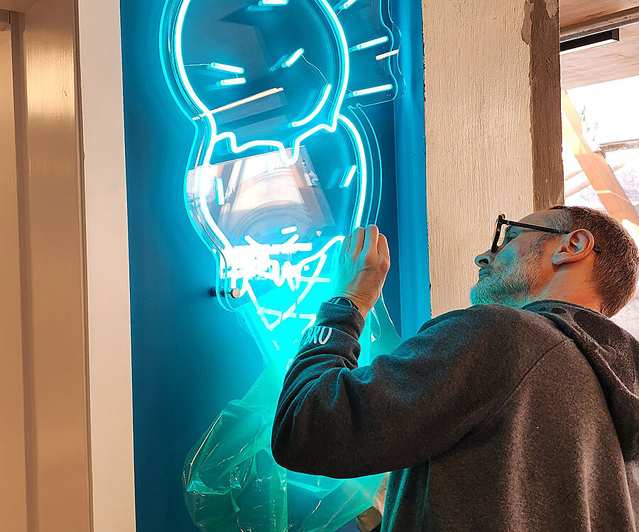 Installing teal LED neon ice-cream light