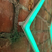 Close-up green LED neon arrow light